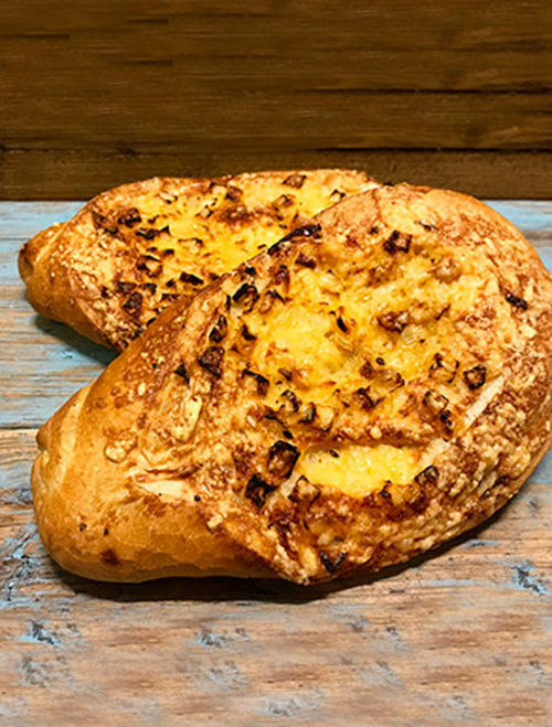 Afbeelding van Uienkruier wit tarwe krokantbrood met kaas en ui